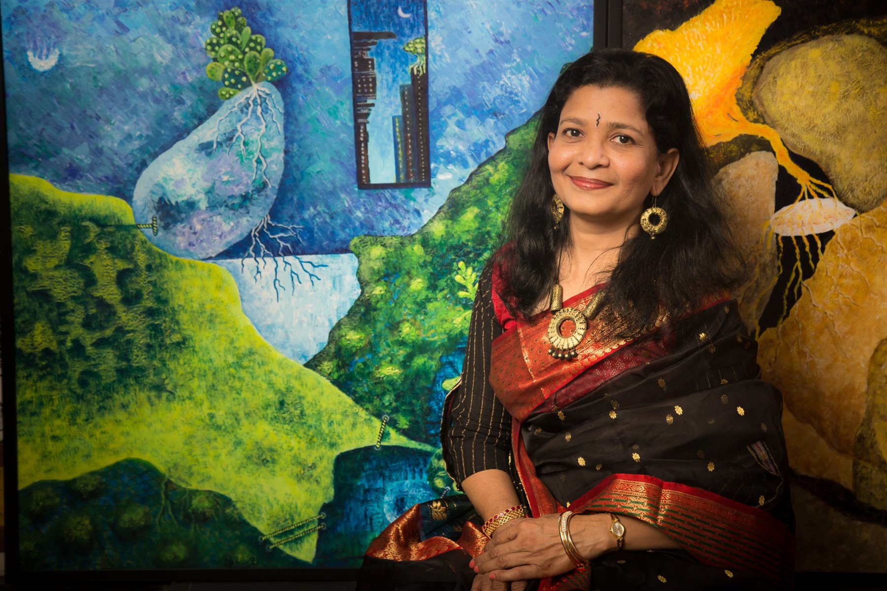 Rajny Krishnan with her paintings